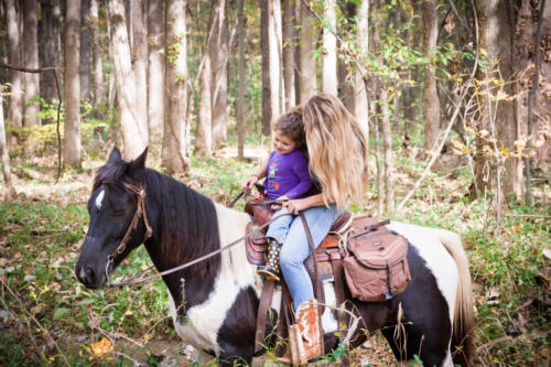 Mother and daughter on horseback